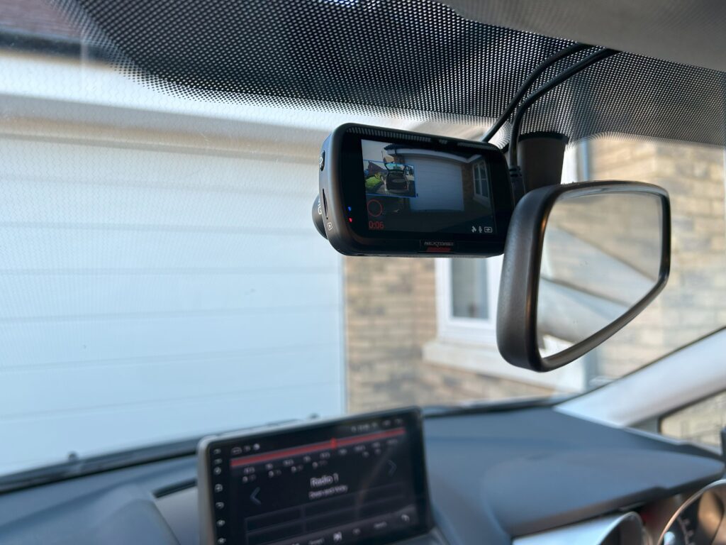 A reversing mirror installation into a motorhome vehicle by an auto electrician.